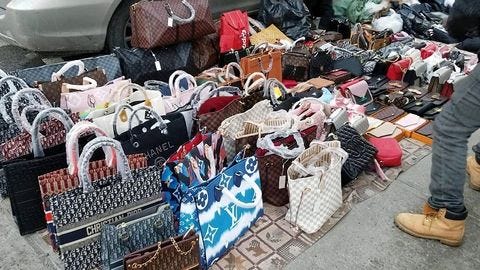 The Psychology Behind Counterfeit Luxury: Why People Buy Fakes and How It Impacts the Market
